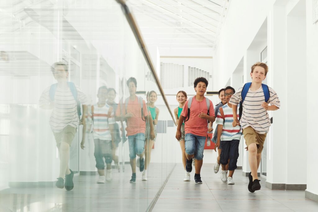 Children in a school's hallway in the concept of top schools in Clapham.